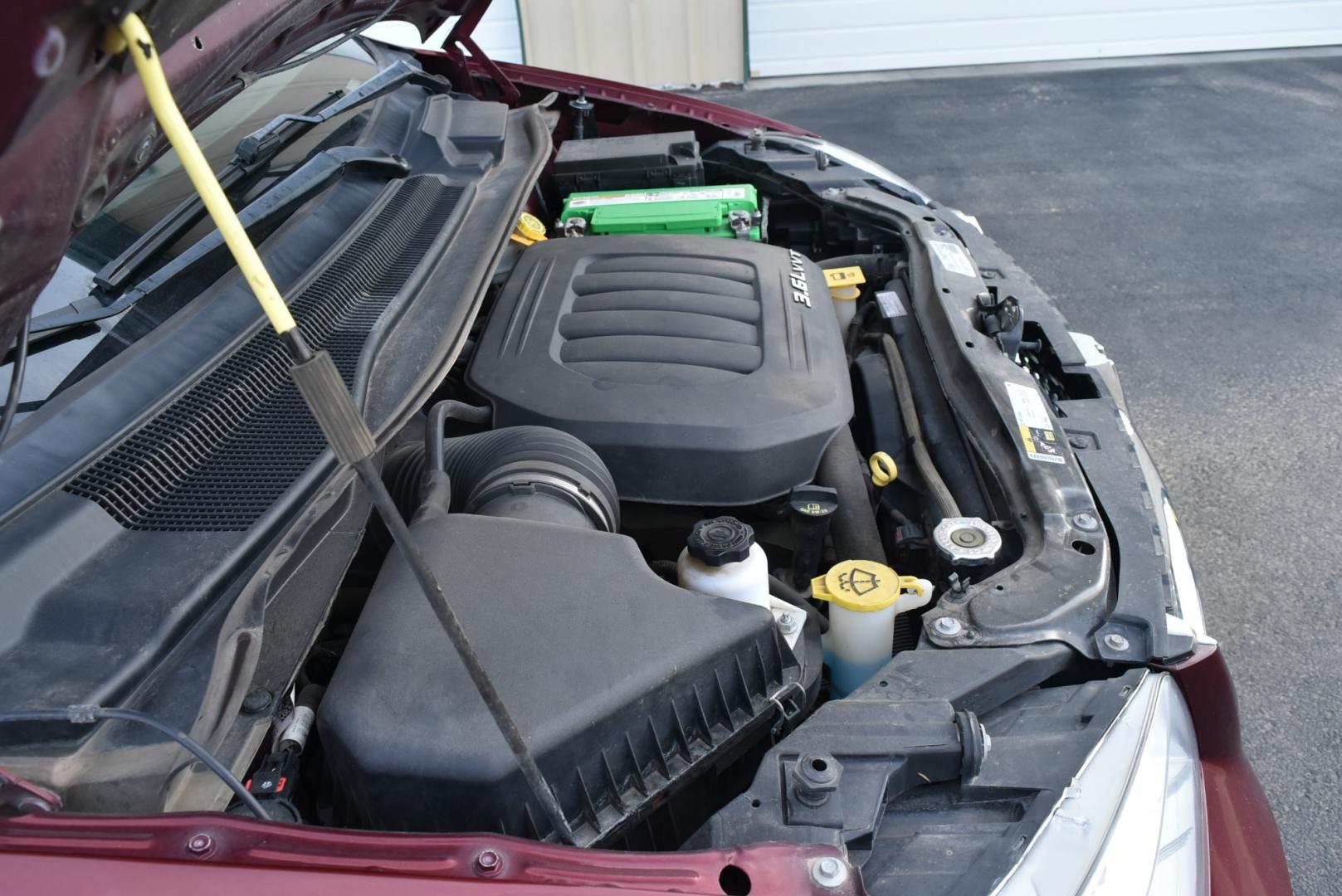 2017 Maroon /Black Dodge Grand Caravan SXT (2C4RDGCGXHR) with an 3.6L V-6 VVT 24 Valve Flex Fuel engine, 6-Speed Automatic transmission, located at 1600 E Hwy 44, Rapid City, SD, 57703, (605) 716-7878, 44.070232, -103.171410 - Photo#28